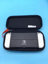 Nintendo Switch Handheld Oled with Charger & Case Used photo 3